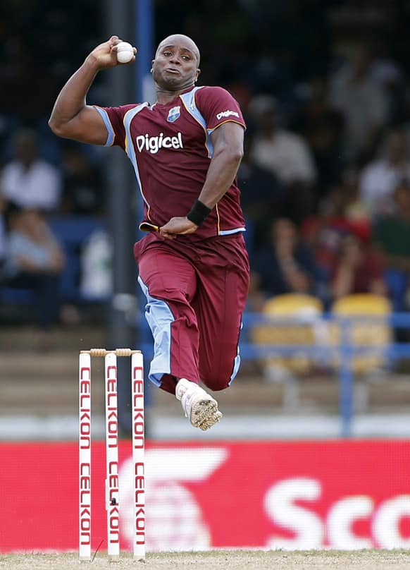 West Indies' Tino Best bowls during the Tri-Nation Series cricket match against India in Port-of-Spain, Trinidad.