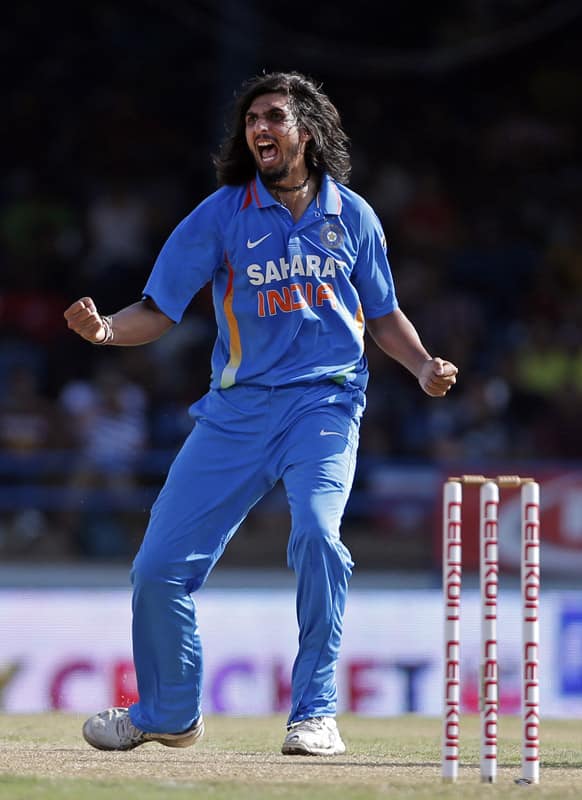 Ishant Sharma celebrates after taking the wicket of West Indies' Marlon Samuels, who was caught behind for six runs, during their Tri-Nation Series cricket match in Port-of-Spain, Trinidad.