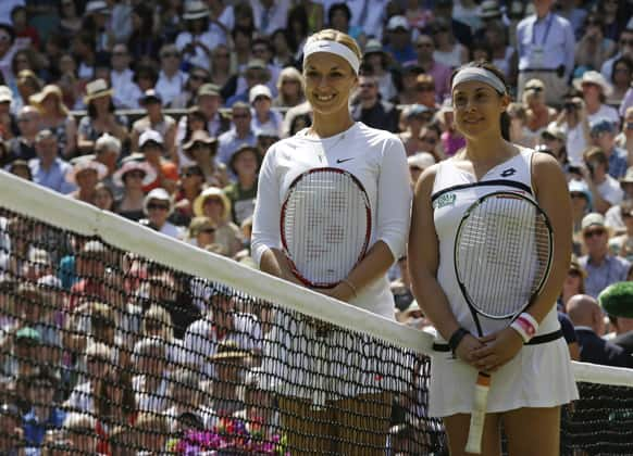 Sabine Lisicki of Germany and Marion Bartoli of France pose for photographers before their Women's singles final match at the All England Lawn Tennis Championships in Wimbledon.