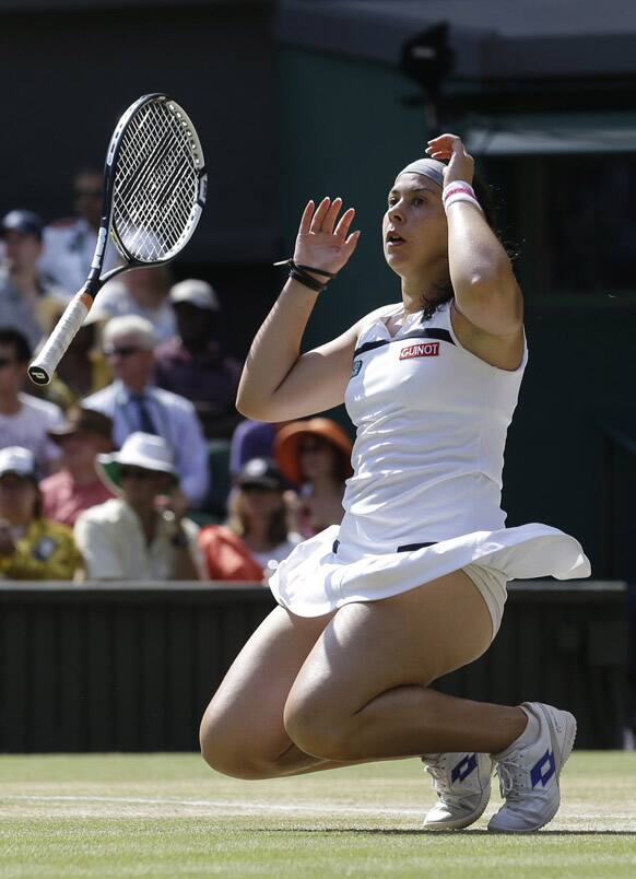 Marion Bartoli of France reacts as she wins the Women's singles final match against Sabine Lisicki of Germany at the All England Lawn Tennis Championships in Wimbledon, London.