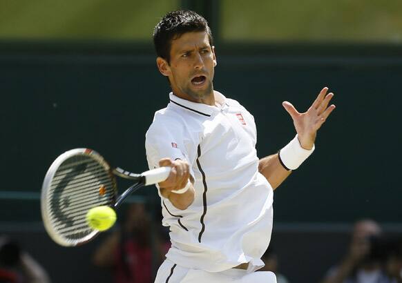 Novak Djokovic of Serbia returns to Andy Murray of Britain during the Men's singles final match at the All England Lawn Tennis Championships in Wimbledon, London.