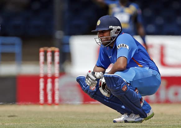 Rohit Sharma grimaces after being hit by a delivery off Sri Lanka's Shaminda Eranga during their Tri-Nation Series cricket match in Port-of-Spain.