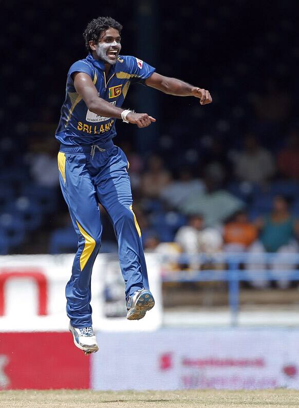 Sri Lanka bowler Shaminda Eranga jumps after a delivery to India batsman Virat Kohli during their Tri-Nation Series cricket match in Port-of-Spain.