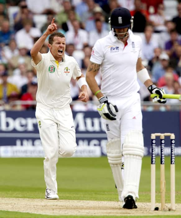 Australia's Peter Siddle celebrates after taking the wicket of England's Kevin Pietersen for 14 caught by Brad Haddin on the first day of the opening Ashes series cricket match against at Trent Bridge cricket ground, Nottingham, England.