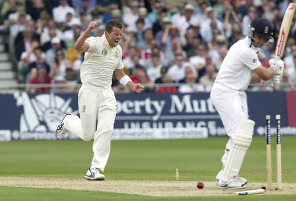 Australia's Peter Siddle celebrates after bowling England's Jonathan Trott for 48 on the first day of the opening Ashes series cricket match at Trent Bridge cricket ground, Nottingham, England.