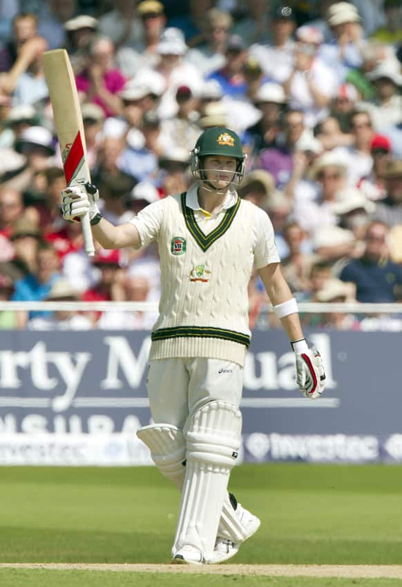 Australia's Steve Smith raises hits bat as he reaches a half-century on the second day of the opening Ashes series cricket match against England at Trent Bridge cricket ground, Nottingham, England.