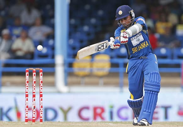 Sri Lanka opening batsman Mahela Jayawardene plays a shot off India's Bhuvneshwar Kumar during the final match of the Tri-Nation cricket series in Port-of-Spain, Trinidad.