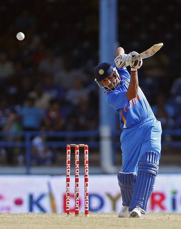 Rohit Sharma hits a four off Sri Lanka's Lasith Malinga during the final match of the Tri-Nation cricket series in Port-of-Spain, Trinidad.