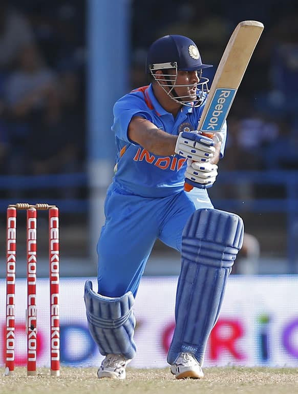 Mahendra Singh Dhoni bats against Sri Lanka during the final match of the Tri-Nation cricket series in Port-of-Spain, Trinidad.