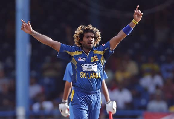 Sri Lanka fast bowler Lasith Malinga celebrates after trapping India's Bhuvneshwar Kumar LBW for a duck during the final match of the Tri-Nation cricket series in Port-of-Spain, Trinidad.