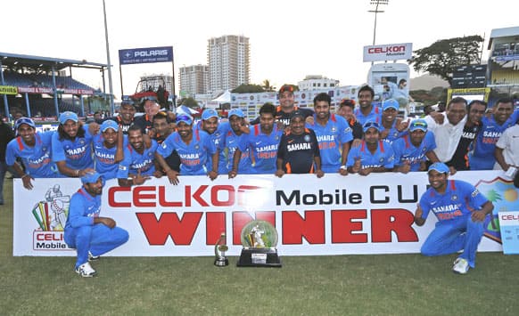 Team India poses with the trophy after winning the final match of the Tri-Nation cricket series against Sri Lanka in Port-of-Spain, Trinidad.