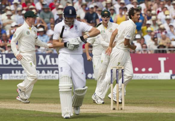 Australia's Ashton Agar celebrates after taking the wicket of England's Jonny Bairstow caught on 15 by Brad Haddin on the third day of the opening Ashes series cricket match at Trent Bridge cricket ground, Nottingham, England.