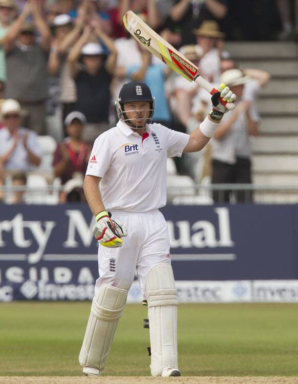 England's Ian Bell raises his bat as he reaches 50 on the third day of the opening Ashes series cricket match against Australia at Trent Bridge cricket ground, Nottingham.