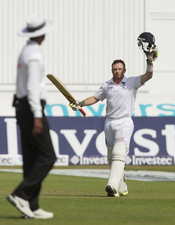 England's Ian Bell celebrates his century on the fourth day of the opening Ashes series cricket match against Australia at Trent Bridge cricket ground, Nottingham, England.