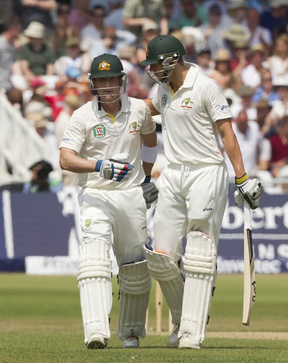 Australia's Brad Haddin, left, and James Pattinson walk from the pitch at lunch on the final day of the opening Ashes series cricket match against England at Trent Bridge cricket ground, Nottingham.