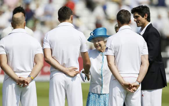 Britain's Queen Elizabeth II meets England cricket players ahead of the Ashes test at Lord's cricket ground in London.