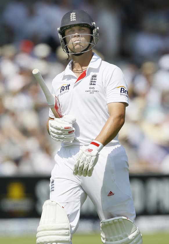 England's Jonathan Trott leaves the pitch after being caught by Usman Khawaja during the Ashes test at Lord's cricket ground in London.