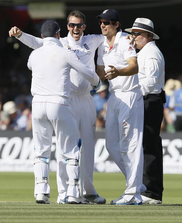 England's Graeme Swann celebrates the wicket of Australia's Ryan Harris, his fifth wicket, during day two of the second Ashes Test match held at Lord's cricket ground in London.