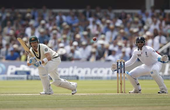 Australia's Michael Clarke, left, plays a shot off the bowling of England's Graeme Swann during day four of the second Ashes Test at Lord's cricket ground in London.