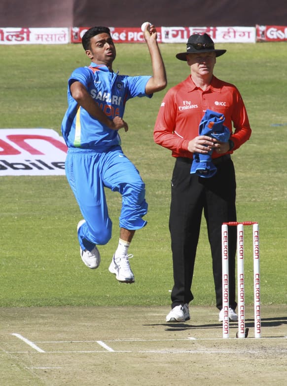 Jaidev Unadkat bowls on the third day of the cricket match against Zimbabwe in Harare.