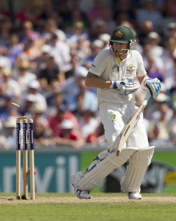 Australia captain Michael Clarke reacts as the ball hits the stumps as he is bowled for 187 by England's Stuart Broad on the second day of the third Ashes series cricket match at Old Trafford cricket ground, Manchester, England.