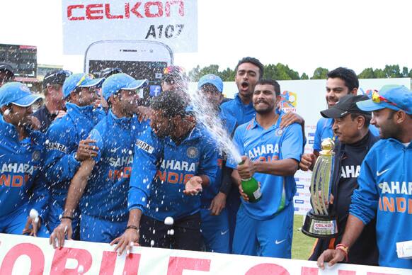 Indian players celebrate after clinching the Celkom Trophy at Queens Sports Club in Bulawayo Zimbabwe after defeating Zimbabwe on the last day of the one day international series.