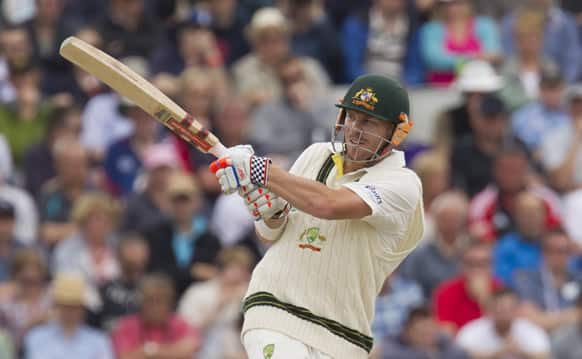 Australia's David Warner plays a shot off the bowling of England's James Anderson on the fourth day of the third Ashes Test series cricket match at Old Trafford cricket ground, Manchester.