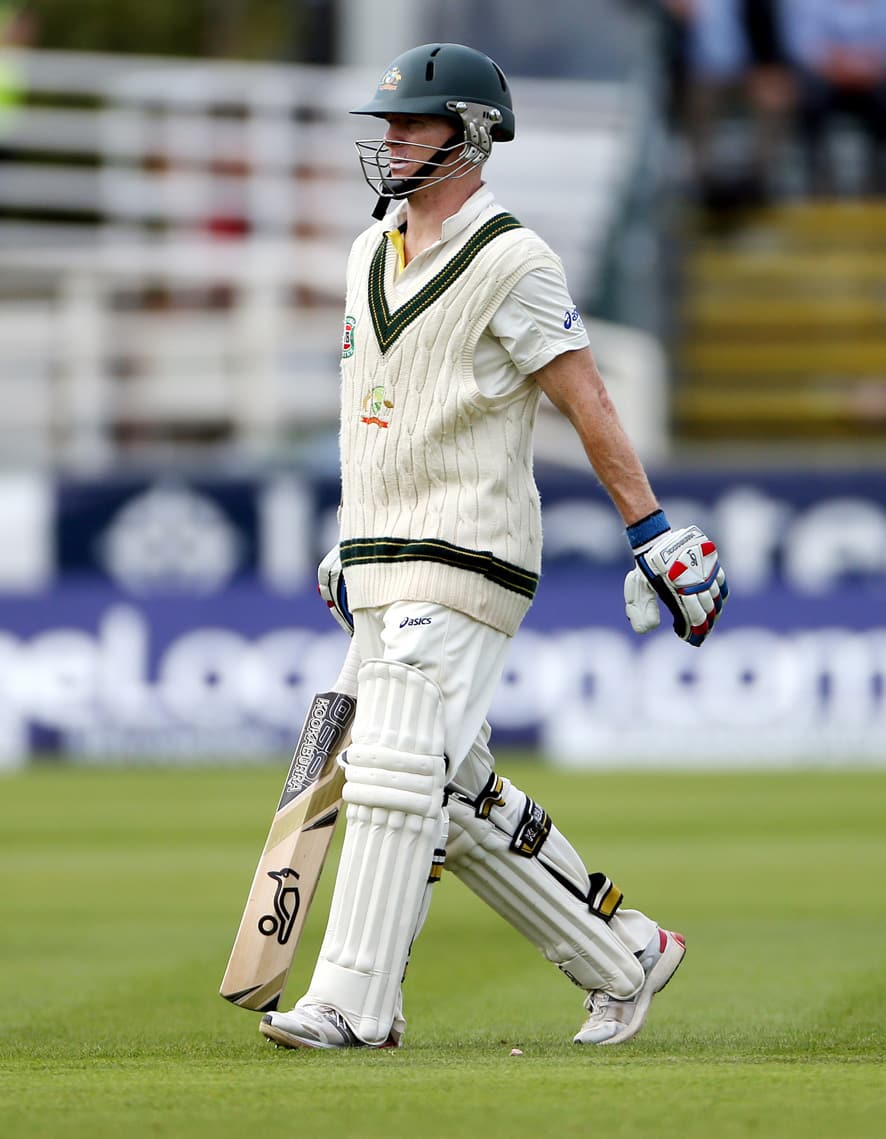 Australia's Chris Rogers walks from the pitch after being caught by England's Jonathan Trott during the fourth day of the fourth Ashes series cricket match at the Riverside cricket ground, Chester-le-Street, England.