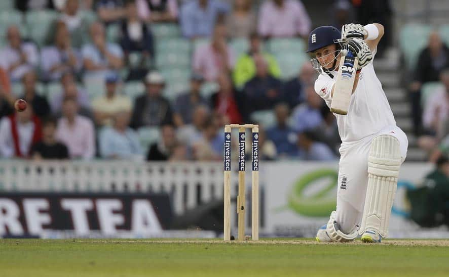 England's Joe Root hits four runs off the bowling of Australia's Peter Siddle during play on the second day of the fifth Ashes cricket Test at the Oval cricket ground in London.