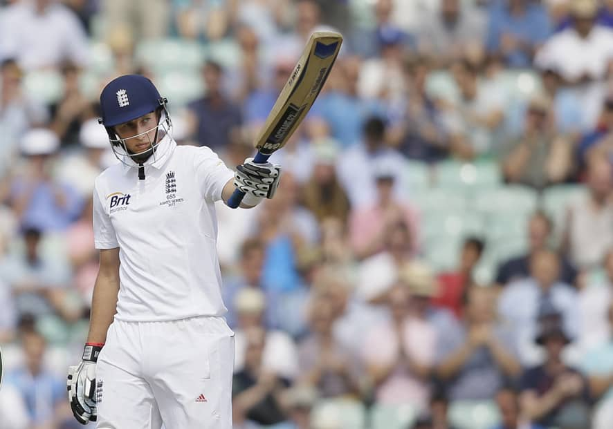 England's Joe Root celebrates his 50 runs not out during play on the third day of the fifth Ashes cricket Test against Australia at the Oval cricket ground in London.