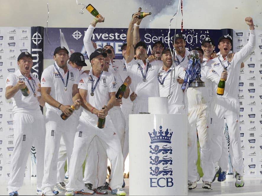 England's captain Alastair Cook, centre, lifts up the Ashes Urn during the presentation ceremony with the rest of the team after the end of the fifth day of the fifth Ashes cricket Test against Australia at the Oval cricket ground in London.