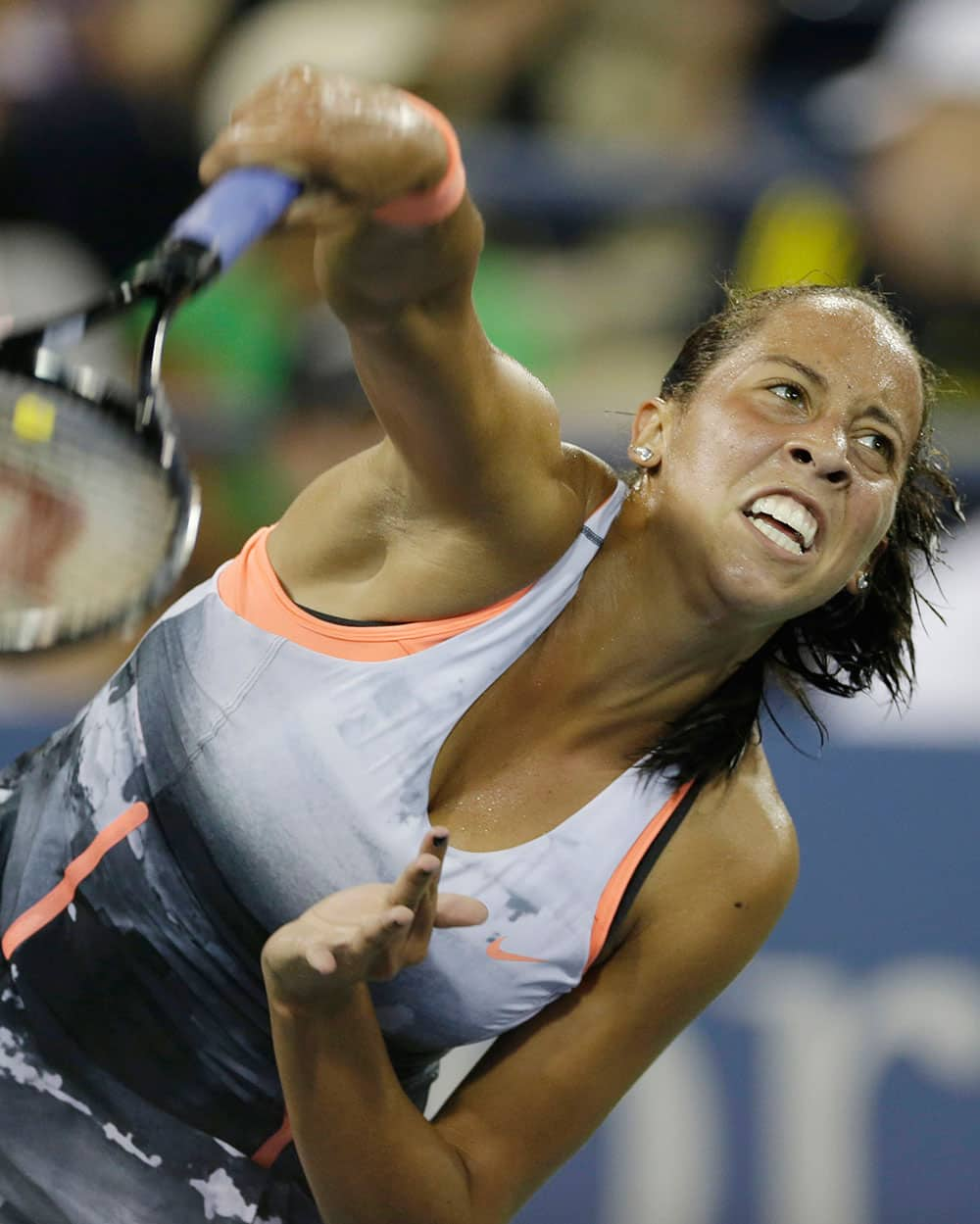 Madison Key serves to Serbia's Jelena Jankovic during the opening round of the US Open tennis tournament.