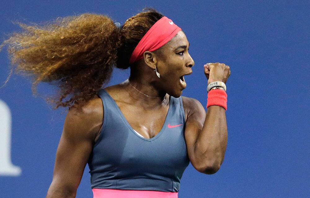 Serena Williams, of the United States, pumps her fist after winning a point against Francesca Schiavone, of Italy, during the first round of the 2013 US Open tennis tournament.