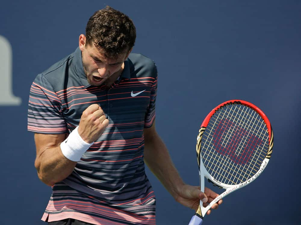 Grigor Dimitrov of Bulgaria reacts during a first round match against Joao Sousa of Portugal at the 2013 US Open tennis tournament.