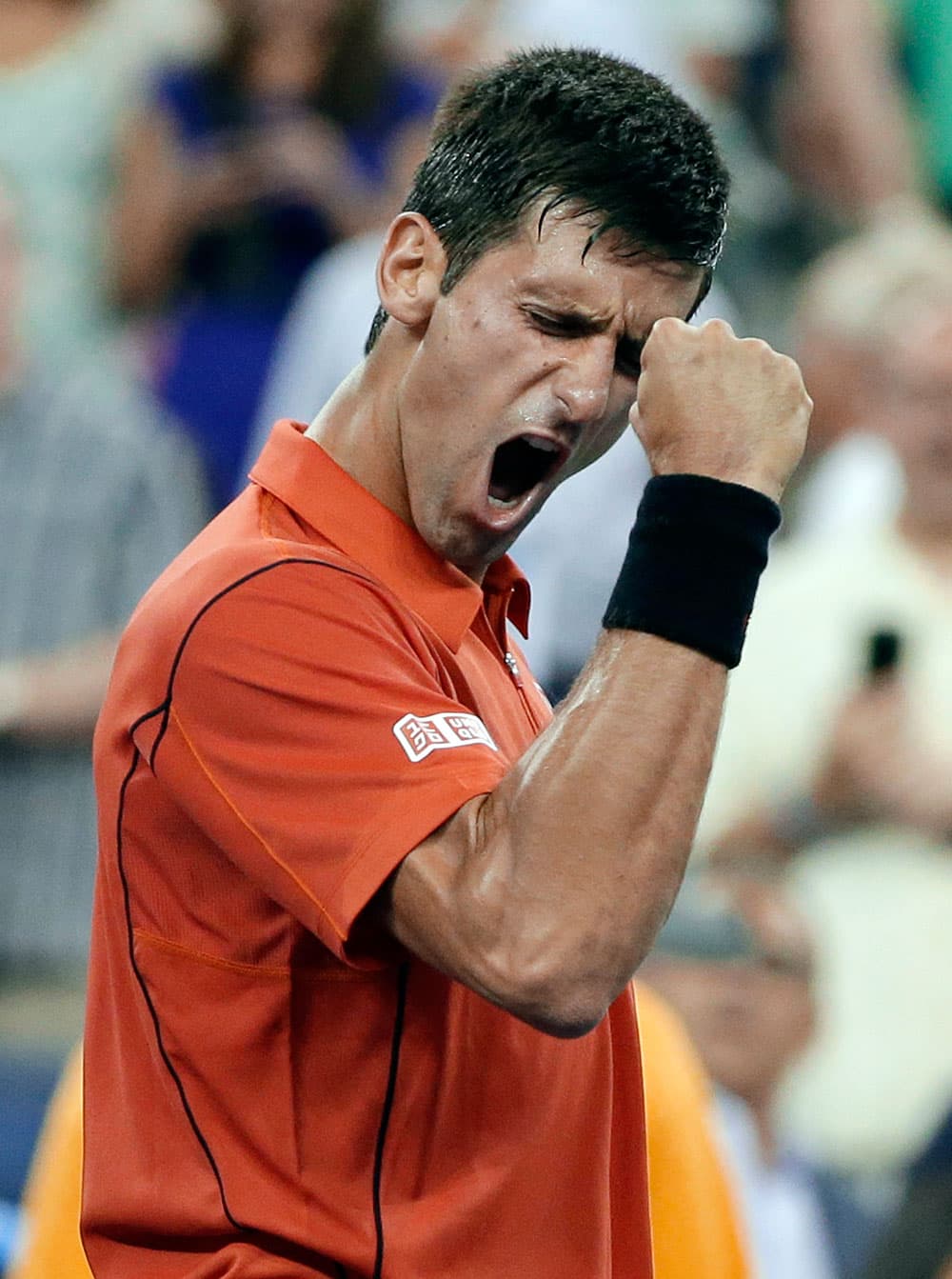 Novak Djokovic, of Serbia, reacts after defeating Ricardas Berankis, of Lithuania, in a first round of the US Open tennis tournament.