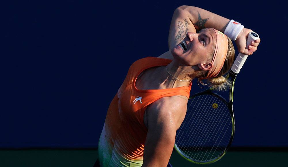 Svetlana Kuznetsova, of Russia, serves against Mallory Burdettte, of the United States, during the first round of the 2013 US Open tennis tournament.