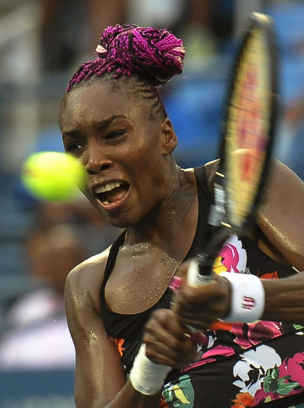 Venus Williams returns a shot to Jie Zheng, of China, during the second round of the 2013 US Open tennis tournament.