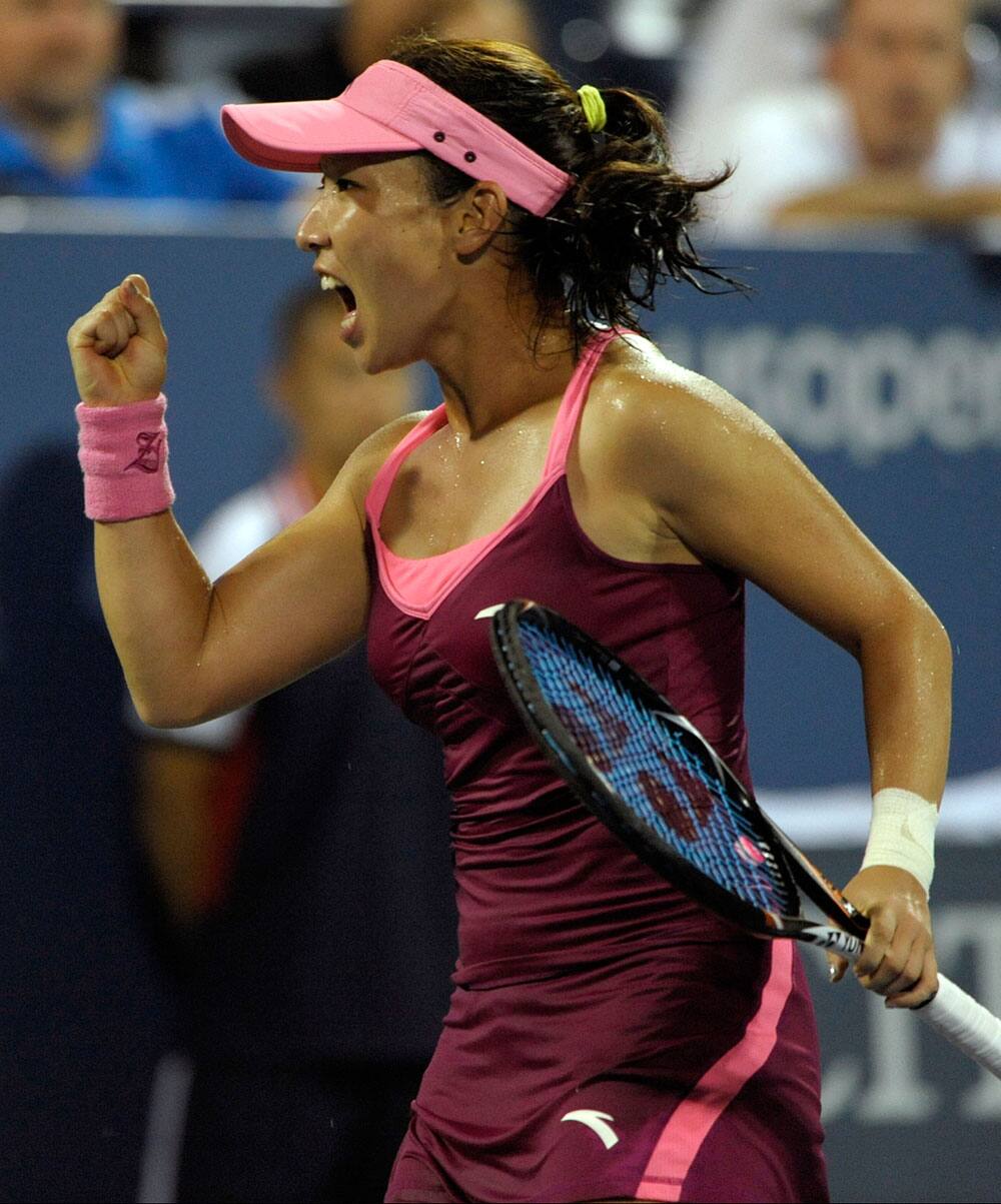 Jie Zheng of China reacts after a shot in a tie breaker against Venus Williams during the second round of the 2013 US Open tennis tournament.