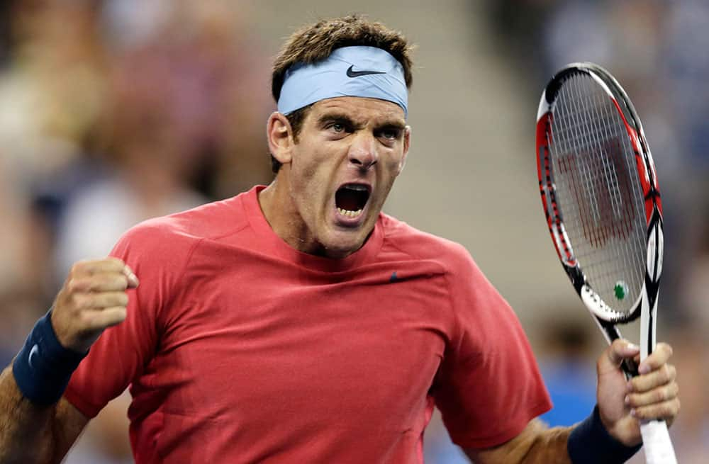 Juan Martin del Potro, of Argentina, yells and pumps his fist after beating Guillermo Garcia-Lopez, of Spain, in the first round of the 2013 US Open tennis tournament.