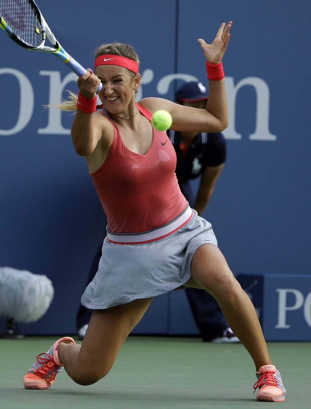 Victoria Azarenka, of Belarus, returns a shot to Aleksandra Wozniak, of Canada, during the second round of the 2013 US Open tennis tournament.