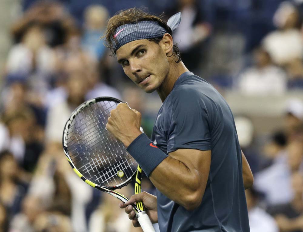 Rafael Nadal, of Spain, pumps his fist after defeating Rogerio Dutra Silva, of Brazil, during the second round of the 2013 US Open tennis tournament.