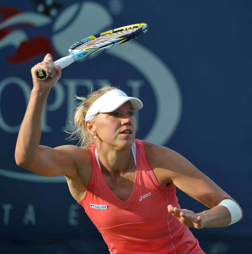 Kaia Kanepi of Estonia returns a shot against Angelique Kerber of Germany during the third round of the 2013 US Open tennis tournament.