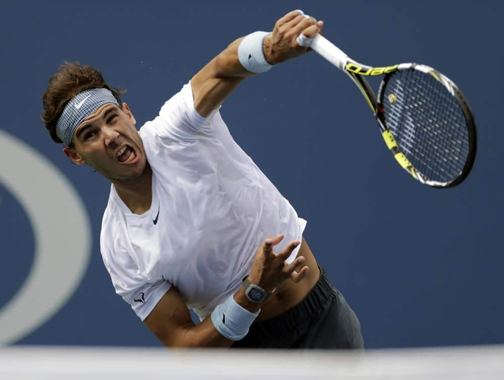 Rafael Nadal, of Spain, serves against Ivan Dodig, of Croatia, during the third round of the 2013 US Open tennis tournament.