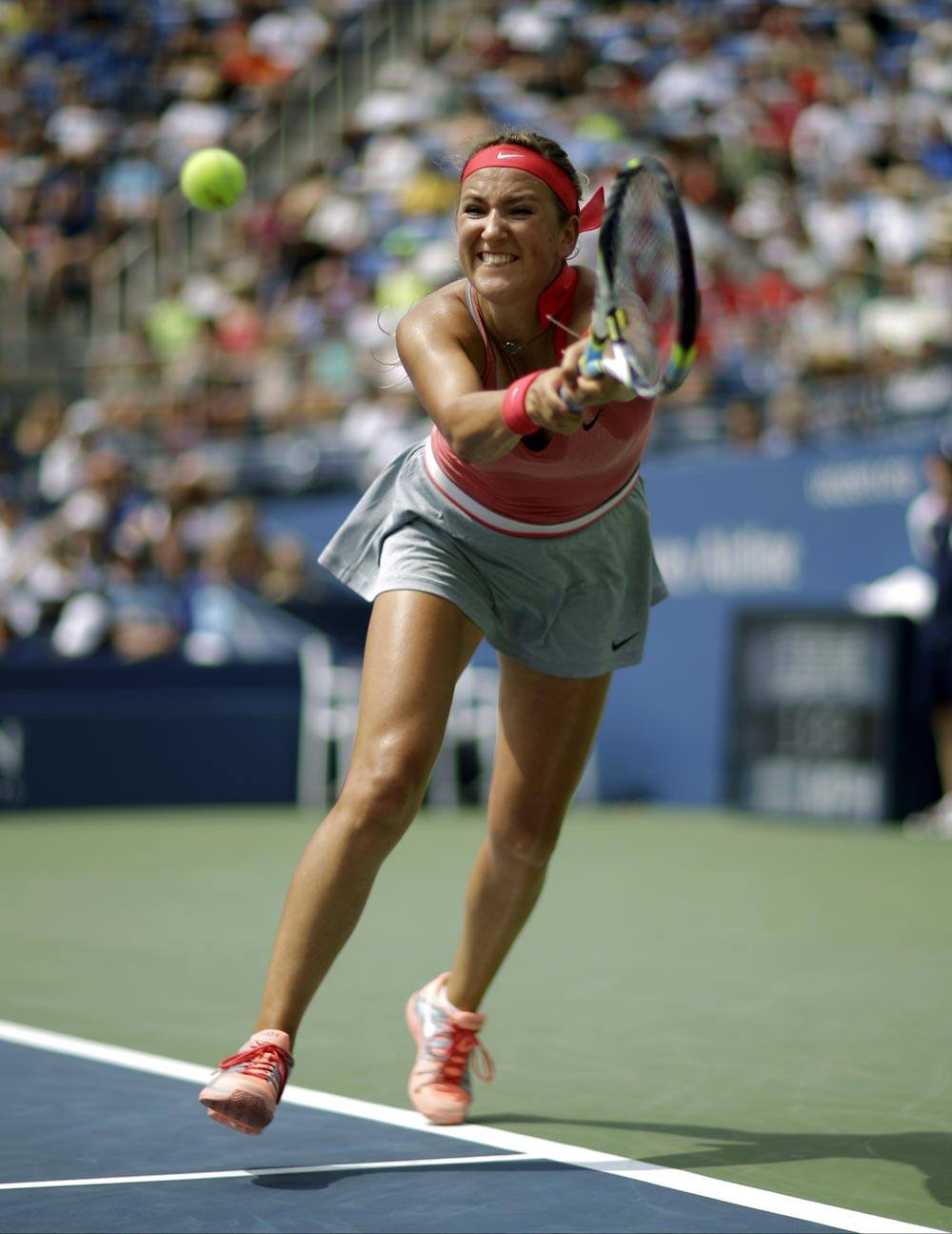 Victoria Azarenka, of Belarus, returns a shot to Alize Cornet, of France, during the third round of the 2013 US Open tennis tournament.