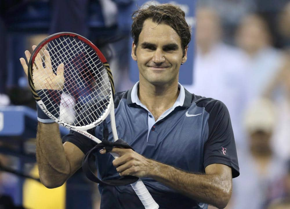 Roger Federer, of Switzerland, thanks fans after defeating Adrian Mannarino, of France, during the second round of the 2013 US Open tennis tournament.