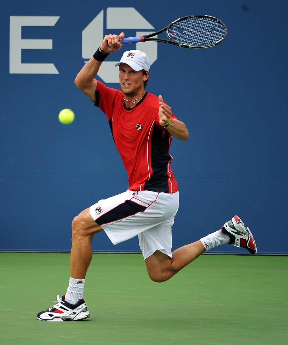 Andreas Seppi, of Italy, returns a shot to Denis Istomin, of Uzbekistan, during the third round of the 2013 US Open tennis tournament.