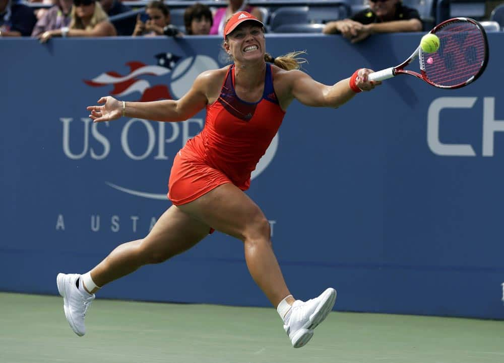 Angelique Kerber, of Germany, returns a shot to Carla Suarez Navarro, of Spain, during the fourth round of the 2013 US Open tennis tournament.