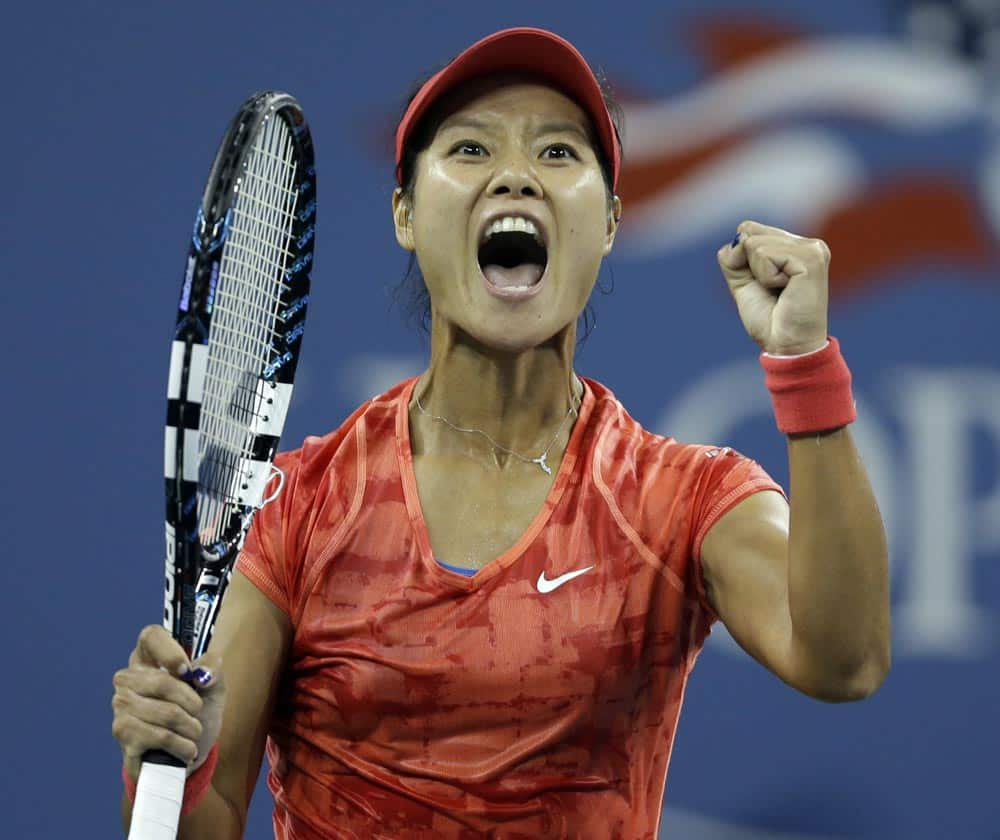 Li Na, of China, reacts after defeating Jelena Jankovic, of Serbia, in a fourth round match at the US Open tennis tournament.