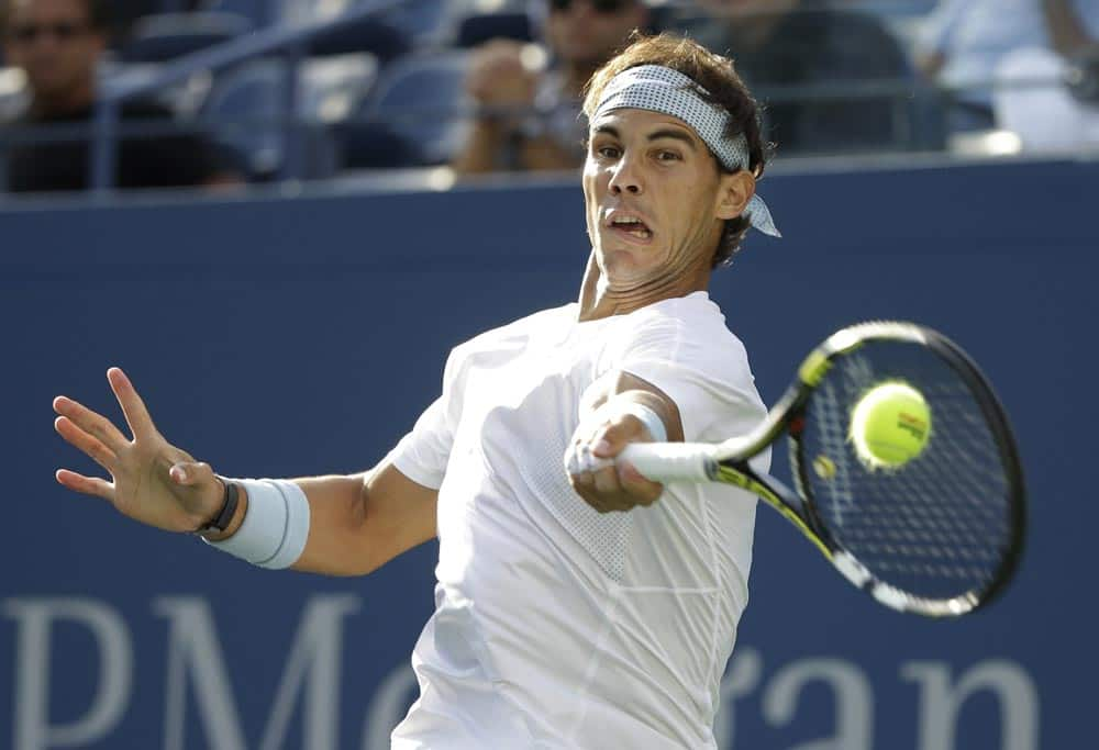 Rafael Nadal, of Spain, returns a shot against Richard Gasquet, of France, during the semifinals of the 2013 US Open tennis tournament.