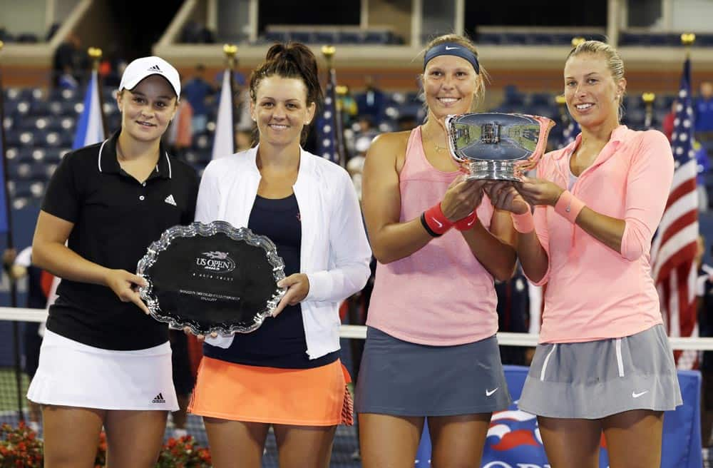 Australia's Ashleigh Barty and Casey Dellacqua pose with the second place trophy alongside Lucie Hradecka and Andrea Hlavackova, of the Czech Republic after Hradecka and Hlavackova won the women's doubles finals of the 2013 US Open tennis tournament.